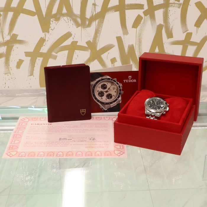 Tudor watch with box, warranty card, and user manual displayed in Houston & Bellaire, TX